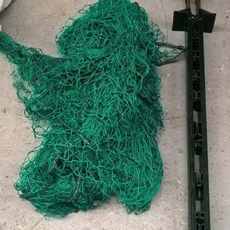 Ball Stop Netting: Low Level 50m Ball Stop Kit with green knotted net and sturdy posts.