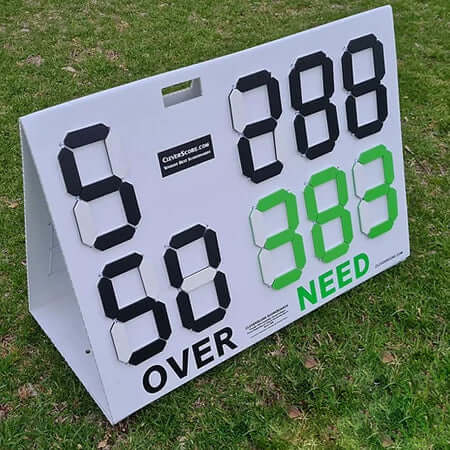 CleverScore Standup Double Sided Manual Cricket Scoreboard displaying scores and overs in a grassy field.